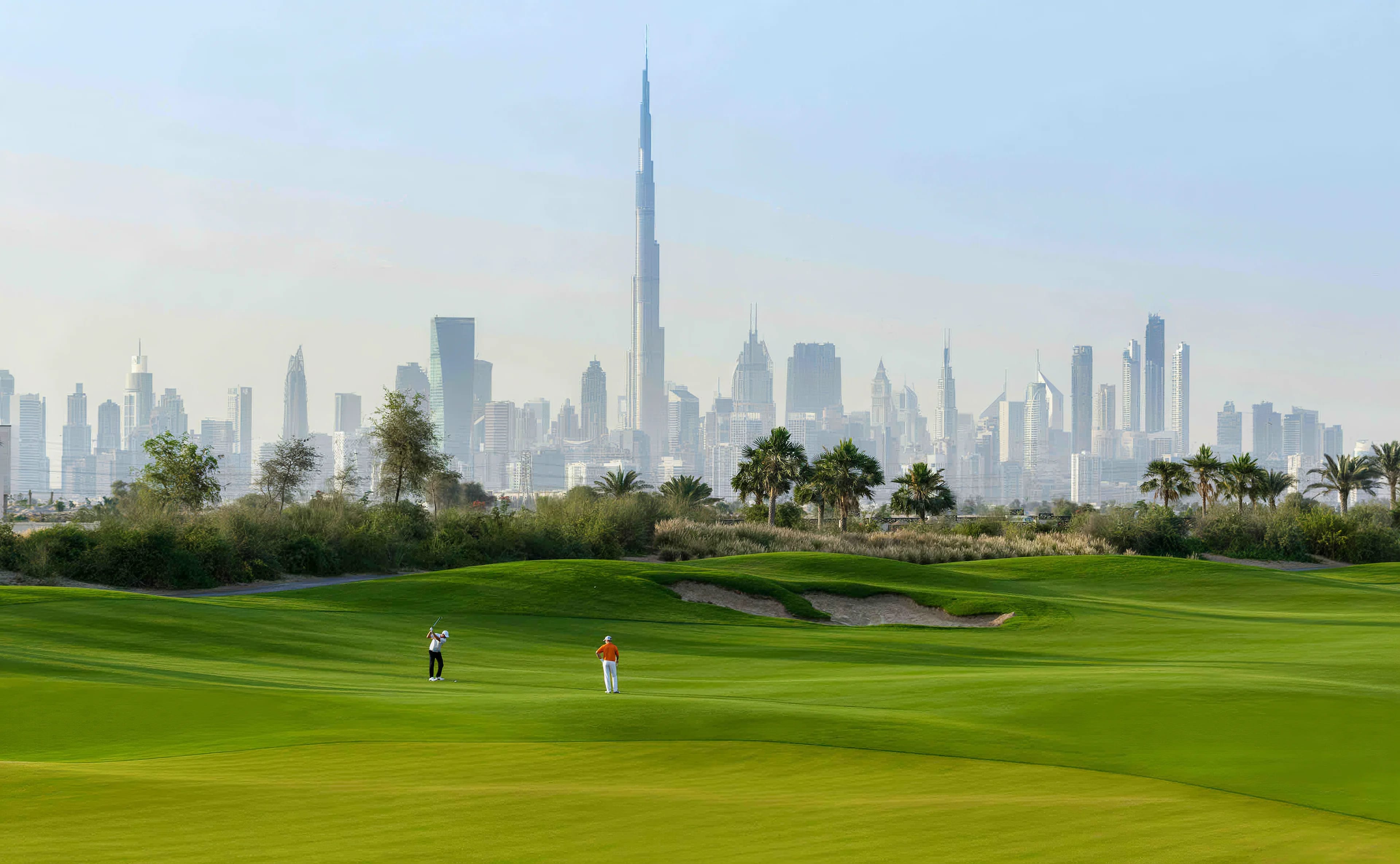Dubai Hills golf course with the Downtown skyline in the distance