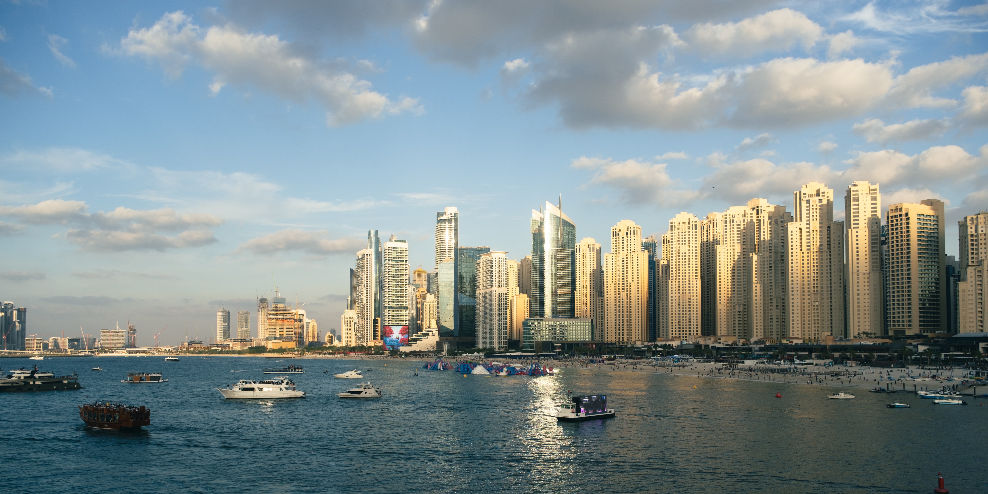 Real JBR waterfront and Dubai Marina skyline beside Dubai Harbour